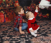 Santa Giving Mason and Sydney A Cookie.png