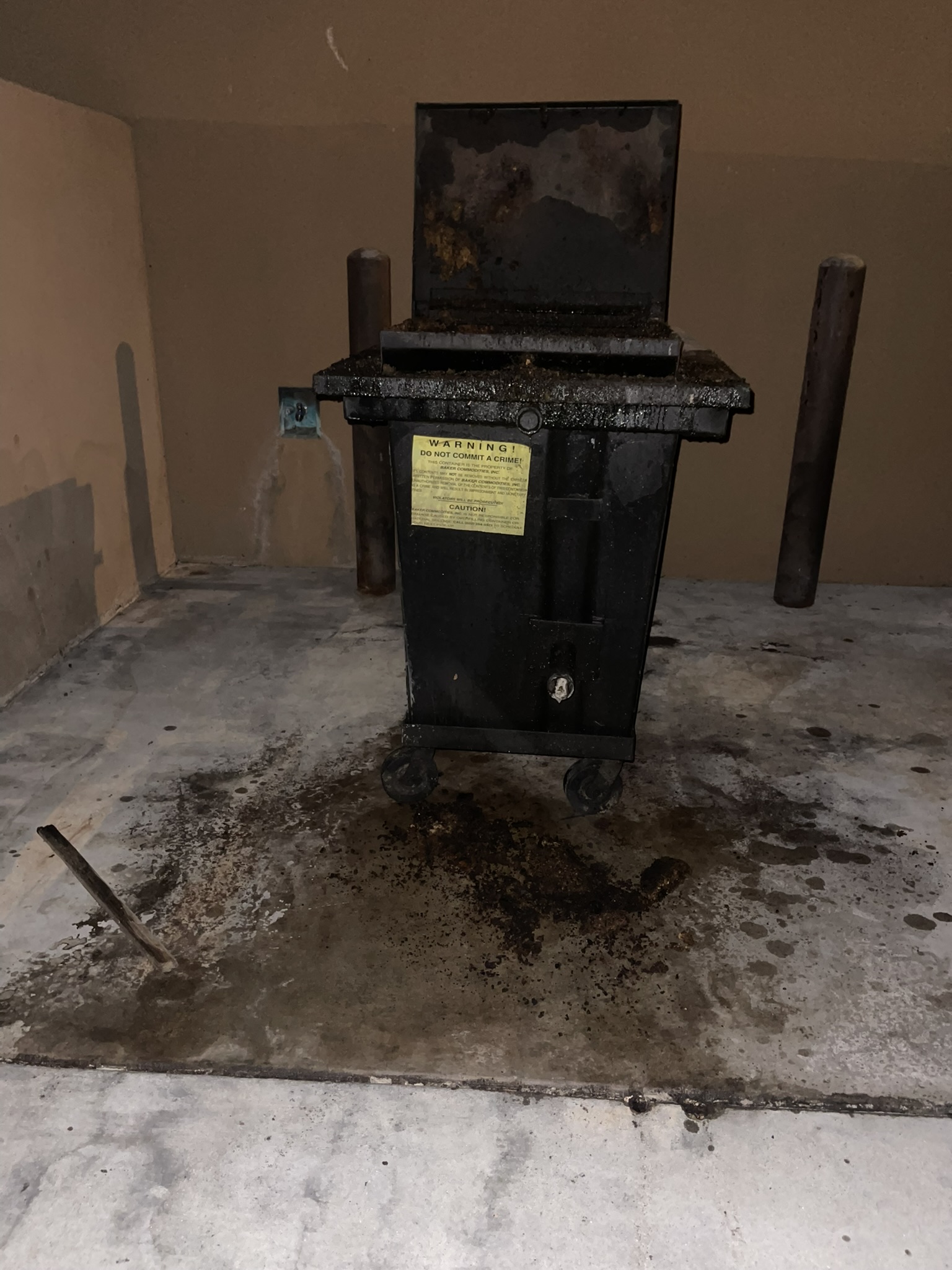 Before: greasy dumpster pad and grease enclosure in Mesa, AZ
